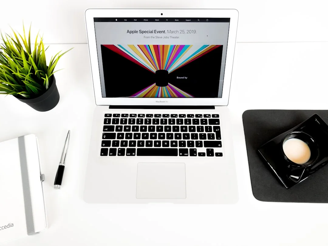 Portable computer with website representing assorted abstract photos under favorites and browser search engine with magnifier symbol